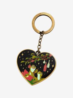 a heart shaped keychain with an image of a slotty on the tree