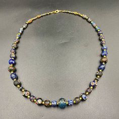 A beautiful multi color glass beads necklace from Ancient Romans time from Afghanistan some gold color brass beads are used as spacers in the necklace we provide fast and free shipping to our customers by which can get the items by 7 maximum working days Black Glass Bead Jewelry, Spiritual Glass Beaded Necklaces, Glass Necklace With Black Round Beads, Black Glass Beaded Necklaces, Glass Beads Necklace, Ancient Roman Glass, Beaded Jewelry Necklaces, Asian Countries, Glass Beads Jewelry