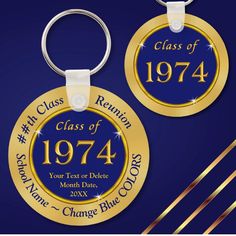 two gold and blue graduation key chains with the words class of 1974 engraved on them