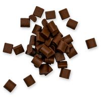 pieces of chocolate are scattered on a white surface