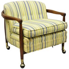 a yellow striped chair with wooden legs