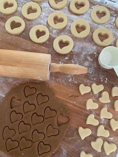 heart shaped cookies being made on a wooden table