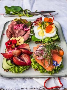 an assortment of food is displayed on a platter