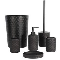 black bathroom accessories set with soap dispenser and toothbrush holder