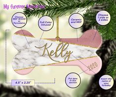 a dog bone ornament hanging from a christmas tree with the names kelly on it