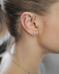 a woman with ear piercings on her ears