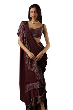 Wine tiered-textured pre-draped ruffle saree with placed sequin embellishments. Comes with padded textured blouse. - Aza Fashions Elegant Festive Blouse Piece With Ruffles, Elegant Ruffled Blouse Piece For Festive Occasions, Silk Saree With Ruffles For Evening, Silk Party Saree With Ruffles, Silk Pre-draped Saree With Ruffles For Party, Silk Pre-draped Party Saree With Ruffles, Traditional Pre-draped Ruffled Saree For Evening, Silk Party Pre-draped Saree With Ruffles, Fitted Pre-draped Saree With Draped Sleeves For Diwali