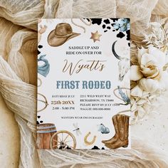 this is an image of a western first rodeo birthday party with cowboy boots and flowers