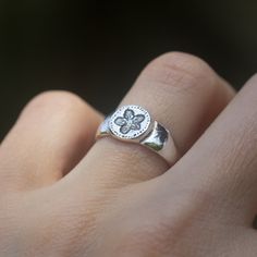 "Wild Flower round signet ring in Sterling silver. This ring is inspired by ancient jewelry style and is made to look a little inaccurate, like ancient roman rings with the craft person signature. The ring is hand sculpted, it was carved in wax and then it was casted in Sterling silver in the lost wax technique. The ring width is (on the front) - 0.3\" inches (8mm) The width on the back side - 0.1\" inches (3mm) Material: Sterling silver 925 * Items ship with a delivery confirmation/Tracking num Scarlet Pimpernel Flower, Pimpernel Flower, Roman Rings, Signet Ring Vintage, Signet Ring Silver, Scarlet Pimpernel, Antique Style Jewelry, Clay Silver, Amazonite Ring