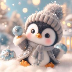 a penguin with a hat and scarf holding a blue ornament in the snow