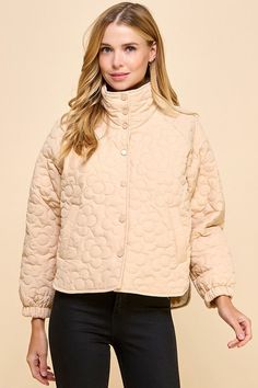 This cute beige jacket boasts a charming floral quilted pattern and playful button down style. Stay cozy and stylish in this unique piece! Fit: True to size. Fabric: 100% polyester Cozy Beige Outerwear With Button Closure, Cream Quilted Outerwear For Spring, Cream Quilted Long Sleeve Outerwear, Casual Beige Quilted Puffer Jacket, Cream Quilted Spring Outerwear, Spring Cream Quilted Outerwear, Quilted Beige Outerwear For Spring, Beige Quilted Outerwear For Fall, Trendy Quilted Beige Outerwear