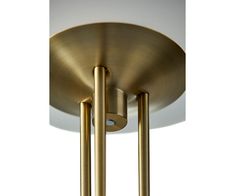 two brass colored lights hanging from the ceiling