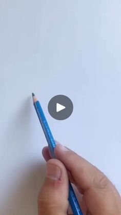 a person holding a pencil in their left hand and writing on paper with the word youtube below it