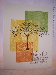 a colorful card with a tree on it and the words grateful heart is the beginning of happiness