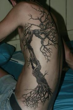 a man with a tree tattoo on his back