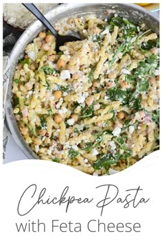 chickpea pasta with feta cheese and spinach in a skillet on the stove