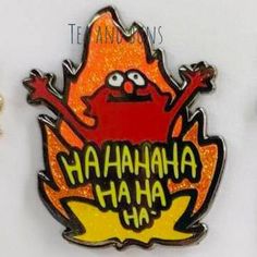 two lapel pins with the words hahanaha ha and an image of a cartoon character