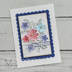 a birthday card with flowers on it