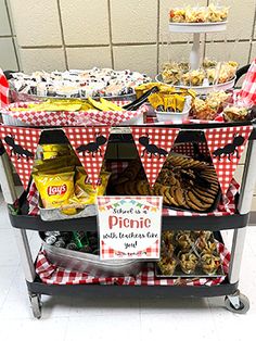 a shopping cart filled with lots of food on top of a white tile floor next to a wall