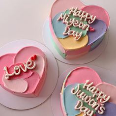 three heart shaped cakes with the words happy valentine's day written on them