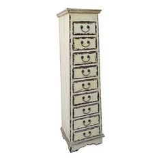 a tall white dresser with drawers on it