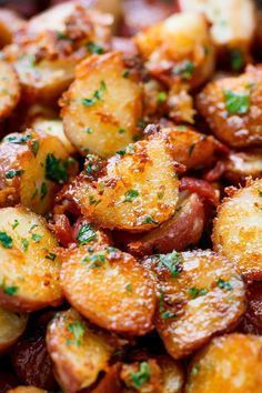 closeup of potatoes with parsley on top and seasoning sprinkled over them