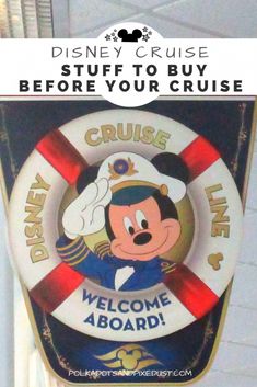 the disney cruise sign is hanging from the ceiling