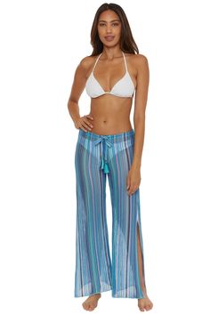 -Split leg multi-way long wide leg or harem pant -Multi-colored stripe jacquard crochet knit -Ties at hem to create harem look -Adjustable drawstring waist with tassels -32" inseam -100% Polyester Beach Striped Pants With Elastic Waistband, Striped Beach Pants With Elastic Waistband, Beach Striped Wide-leg Pants, Striped Wide-leg Beach Bottoms, Multicolor Harem Beach Pants, Multicolor Harem Pants For Beach, Striped Long Pants For Beach, Striped Pants For The Beach, Beach Stretch Harem Bottoms