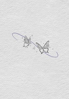 two butterflies flying in the air with stars on their wings, and one is drawn by hand