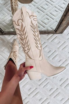 Product details: Color base: Off white Vegan synthetic leather Embroidered tall boot Insole material: padded Sole of heel: leather wrap heel Pointed toe Hidden side zipper True to size Sizing: Shaft height: 13.75" Heel height: 2.5" Western Inspired Outfits, Cute Cowgirl Boots, Cowgirl Boots Outfit, Womens Cowgirl Boots, Wedding Boots, Tan Boots, Wrap Heels, Tall Boot, Western Boot