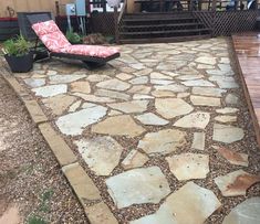 a chair sitting on top of a stone patio