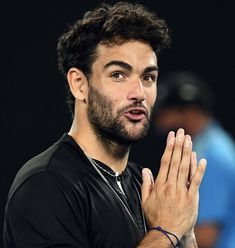 a close up of a person holding his hands together