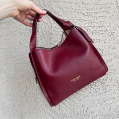 Kate Spade Classic Burgundy Maroon Red Wine Pebbled Leather Knott Medium Crossbody Tote Bag Top Handles Detachable Adjustable Crossbody Strap Triple Compartment: Outer Compartments Magnetic, Interior Zip Compartment W/ Pouch, Pocket Semi-Structured Genuine Leather Exterior Faux Suede Lining Note: There Are Some Indentations On The Front & More Pointed Indents On The Back As Shown. Overall Guc Classic Burgundy Tote Bag, Burgundy Soft Leather Bag With Double Handle, Everyday Burgundy Bag With Gold-tone Hardware, Modern Burgundy Tote Shoulder Bag, Burgundy Double Handle Bags With Gold-tone Hardware, Crossbody Tote Bag, Burgundy Wine, Crossbody Tote, Kate Spade Bag