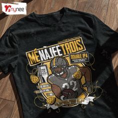 a t - shirt with a football player on it sitting on the floor next to a wooden floor