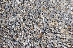 rocks are arranged on top of each other to create a texture or pattern in this photo