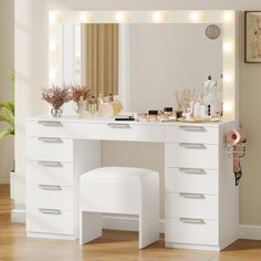 a white vanity table with lights on it