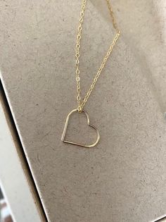 This simple, dainty 14k gold filled floating open heart necklace can be customized to your preferred length.  It's simply suspended from delicate 14k gold filled chain finished with a lobster claw clasp.  The heart is a great size, not too small and not too big at 17.5mm.  A wonderful handmade jewelry gift for bridesmaids, best friend, anniversary or a special woman on any occasion! You may also like to check out more of my necklaces here: http://etsy.me/2kMdyB0 Free first class USPS shipping wi Minimalist 14k Gold Open Heart Jewelry, Dainty 14k Gold Heart Necklace With Adjustable Chain, Minimalist 14k Gold Filled Open Heart Jewelry, 14k Gold Filled Necklaces For Valentine's Day Anniversary, Rose Gold Open Heart Charm Necklace With Delicate Chain, Gold Open Heart Necklace With Delicate Chain, 14k Gold Open Heart Necklace For Gift, Dainty 14k Gold Open Heart Necklace, Minimalist Yellow Gold Open Heart Jewelry