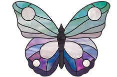 a stained glass butterfly sitting on top of a white background