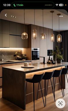 the kitchen is clean and ready to be used for dinner or breakfast time, with modern lighting