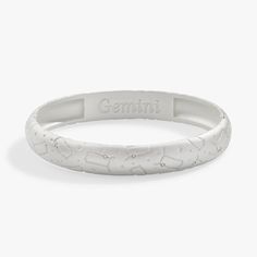 Embrace your Gemini pride with this satin finish hinge bangle. Featuring an interior "Gemini" engraving, the bracelet is adorned with the sign's constellation and shimmering crystals for a subtle yet beautiful effect. A perfect way to show off your personality and style. Fits wrists up to 7.25", with a hinged closure Finishes: Satin Silver, Satin Gold Nickel-free Adorned with Clear crystals How To Clean Metal, Gemini Zodiac, Cross Bracelet, Clear Crystals, Charm Bangle, Butterfly Charm, Hinged Bangle, Jewelry Cleaner, Shiny Silver