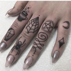 a woman's hand with some tattoos on it and a spiderweaver