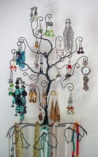 there is a tree that has many earrings on it