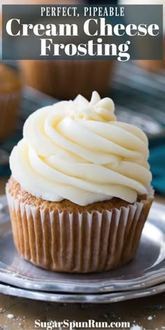 a cupcake with cream cheese frosting on top