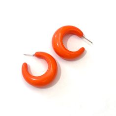 "Orange hoop earrings in a great bold shape. Retro opaque jewelry always makes me think of Lucy. Each earring hoop measures just under 1.5\" or 36mm in diameter in a chunky width - these are your retro-chic, lovely and classic, yet funky & new, it's great to be a girl, hoop earrings. Most all earrings are made with vintage lucite parts that were made in the US in the 1960's - early 80's. We hand-set them with surgical steel earring posts and they have sturdy surgical steel/acrylic backings o Trendy Small Hoop Orange Earrings, Retro Small Hoop Earrings Gift, Retro Small Hoop Earrings As Gift, Orange Small Hoop Earrings With Ear Wire, Small Retro Hoop Earrings As Gift, Nickel-free Orange Hoop Earrings, Chunky Small Hoop Earrings For Gift, Chunky Small Hoop Earrings As Gift, Earring Hoop