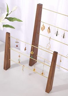 the jewelry rack is made out of wood