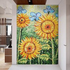 a painting of sunflowers and butterflies on a wall