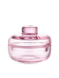 a pink glass container with a lid on a white background, it looks like something out of space