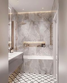 a bathroom with marble walls and tile flooring, along with a white bathtub