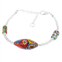 Decorate your wrist with this elegant and exquisite Murano bracelet. Handcrafted in one of the most famous and labor-intensive Murano Glass techniques called Millefiori ("a thousand flowers" in Italian), this Venetian bracelet dazzles with rich colors and artistic mosaic-like patterns. Trendy millefiori beads in olive and cylinder shapes connected by a string of tiny handcrafted silver-lined beads create a perfect combination of stylish contemporary design and timeless Venetian style. A must-hav Elegant Multicolor Flower Beaded Bracelets, Elegant Multicolor Beaded Bracelets With Strap, Bracelets Elegant, Millefiori Beads, Murano Jewelry, Fantasy Earrings, Murano Glass Jewelry, Italian Jewelry, Cylinder Shape