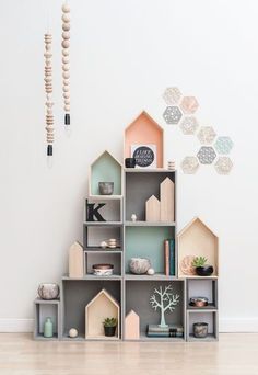 a room with shelves and decorations on the wall